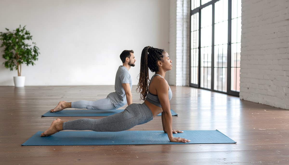 Professional instructor demonstrating proper stretching form